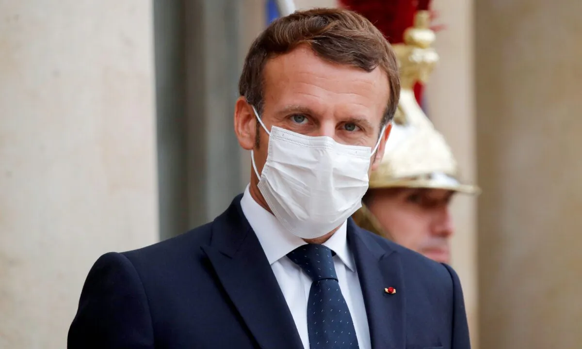 French President Emmanuel Macron, wearing a face mask, at the Elysee Palace in Paris, on October 22, 2020. (Charles Platiau/Pool/AFP via Getty Images)