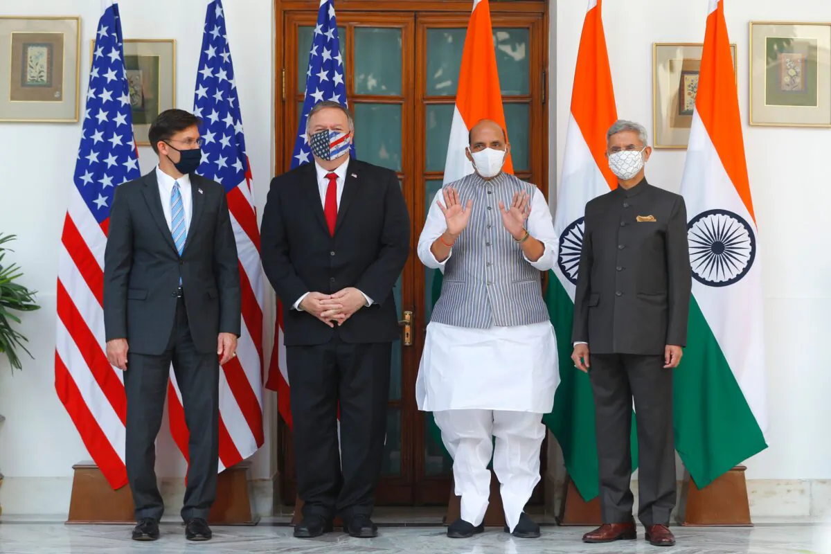 U.S. Secretary of State Mike Pompeo (2nd L), U.S. Secretary of Defense Mark Esper (L), India's Defense Minister Rajnath Singh (2nd R) and India's Foreign Minister Subrahmanyam Jaishankar pose for pictures before their meeting at Hyderabad House in New Delhi on Oct. 27, 2020. (Adnan Abidi/POOL/AFP via Getty Images)