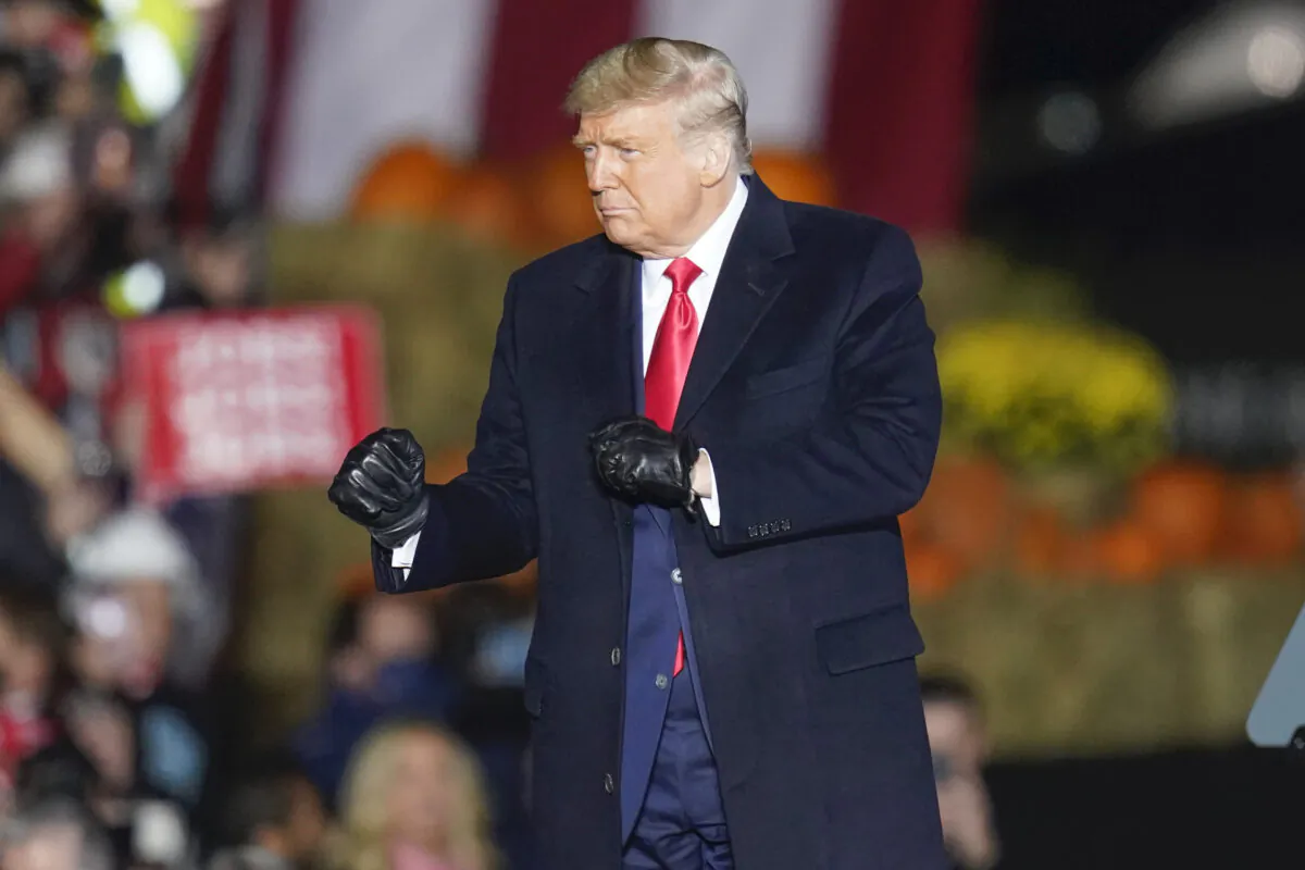 President Donald Trump dances as he leaves a campaign stop at the Butler County Regional Airport in Butler, Pa., on Oct. 31, 2020. (Keith Srakocic/AP Photo)