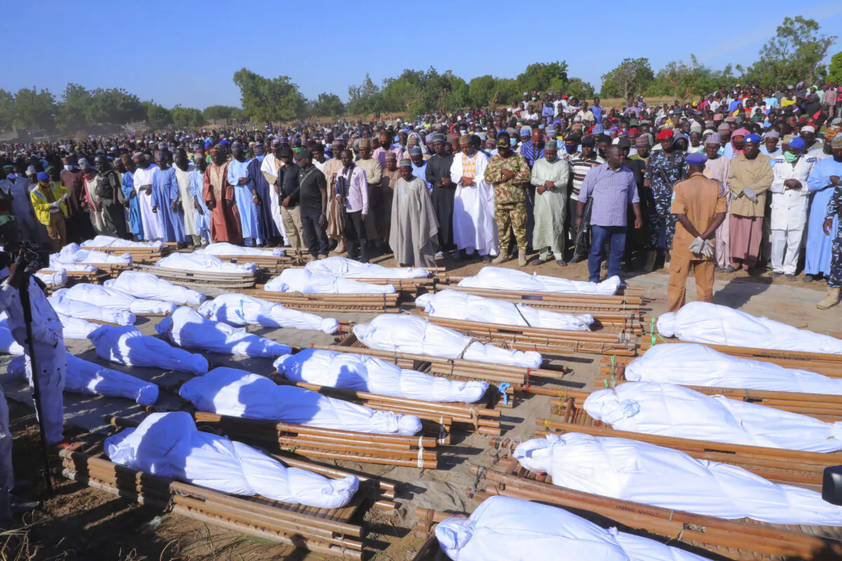 People attend a funeral for those killed by suspected Boko Haram militants in Zaabarmar, Nigeria, on Nov. 29, 2020. (Jossy Ola/AP Photo)