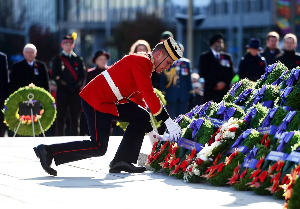 A soldier places a wreath during Remembrance Day ceremonies at the National War Memorial in Ottawa on Nov. 11, 2017. (The Canadian Press/Sean Kilpatrick)