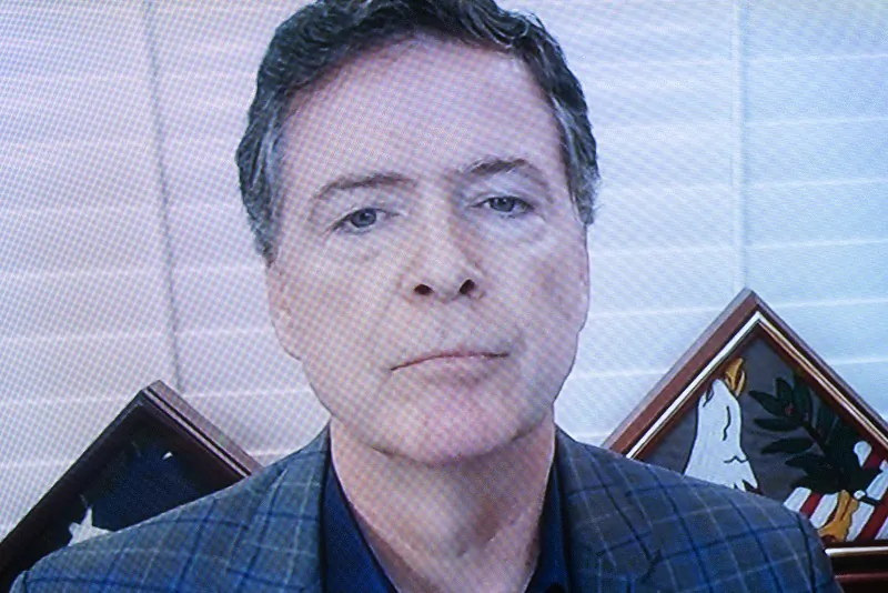 Former director of the Federal Bureau of Investigation James Comey, speaks via a TV monitor during a hearing on Capitol Hill in Washington on Sept. 30, 2020. (Stefani Reynolds/Pool/Getty Images)