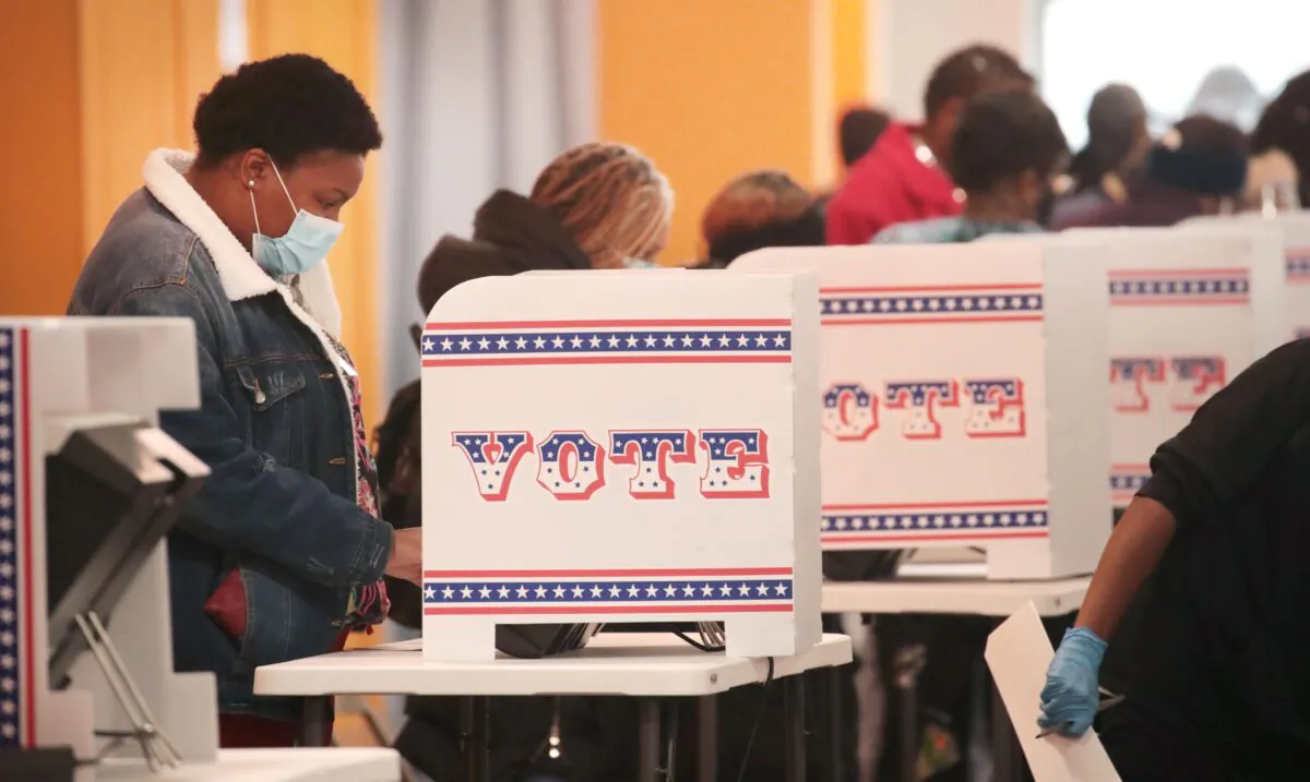 Residents vote at a polling place in the Midtown neighborhood in Milwaukee, Wis., on Oct. 20, 2020. (Scott Olson/Getty Images)
