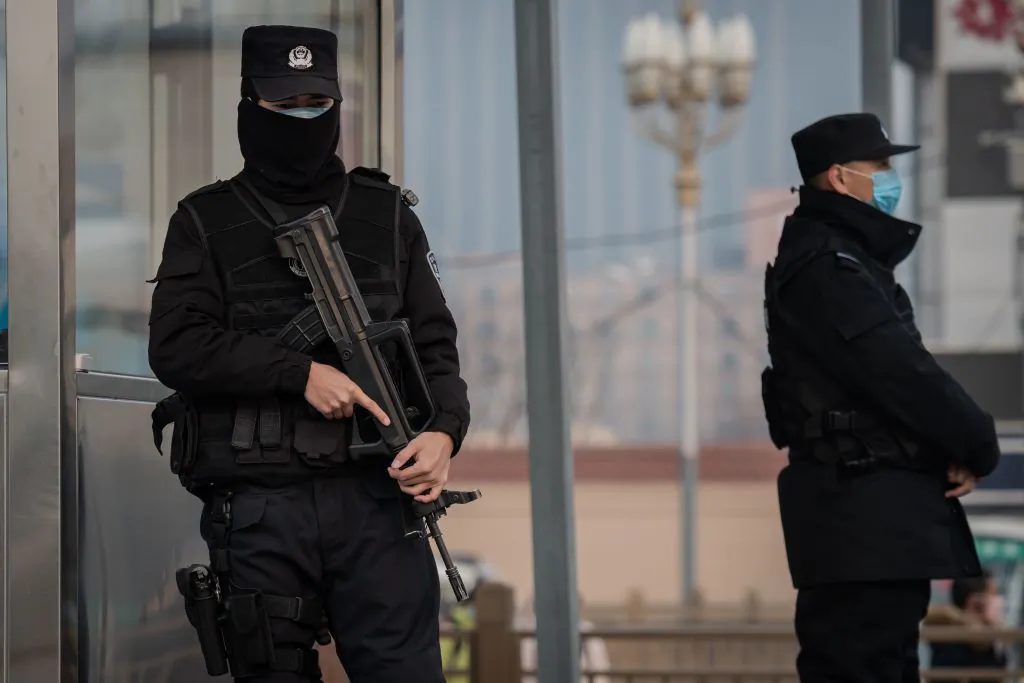 Police officers secure an area at the Beijing railway station on Jan. 27, 2020. (Nicolas Asfouri/AFP via Getty Images)
