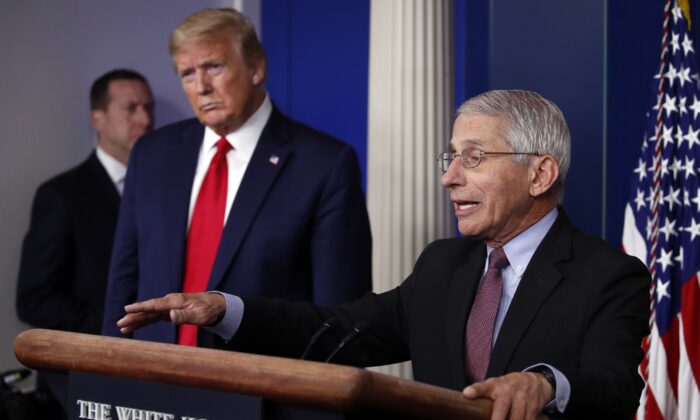 Then-President Donald Trump listens as Dr. Anthony Fauci, director of the National Institute of Allergy and Infectious Diseases, speaks about the CCP virus in the James Brady Press Briefing Room of the White House in Washington on April 22, 2020. (Alex Brandon/AP Photo)