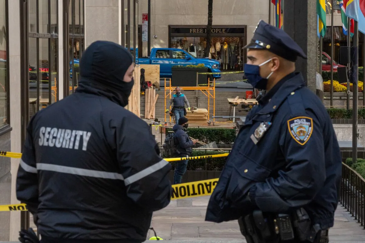 A police officer and a security guard are seen in New York City on Nov. 2, 2020. (David Dee Delgado/Getty Images)