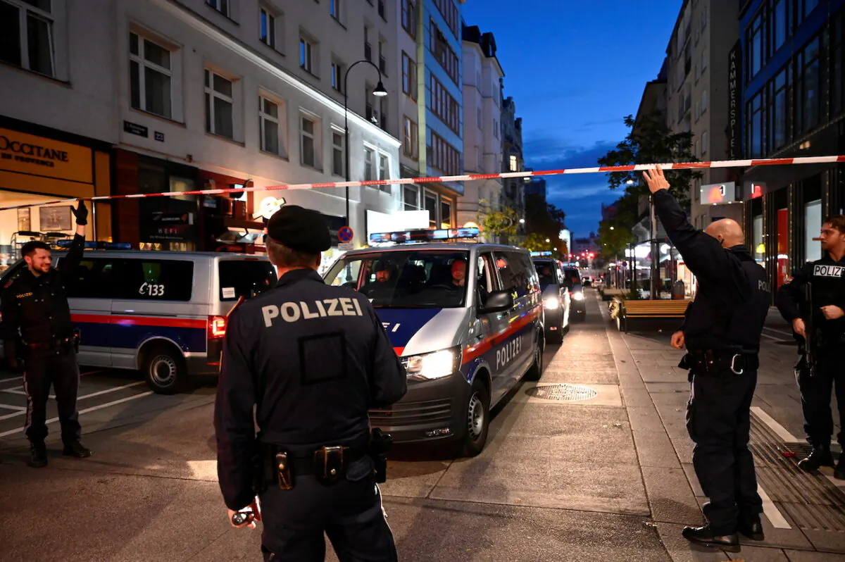 Police officers block a street after exchanges of gunfire in Vienna on Nov. 3, 2020. (Radovan Stoklasa/Reuters)