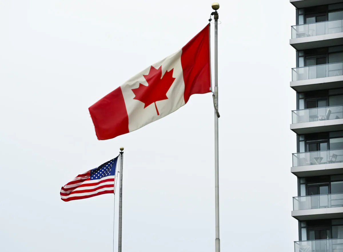 American and Canadian flags fly outside the United States consulate in Toronto on Nov. 3, 2020. (Nathan Denette/The Canadian Presss)