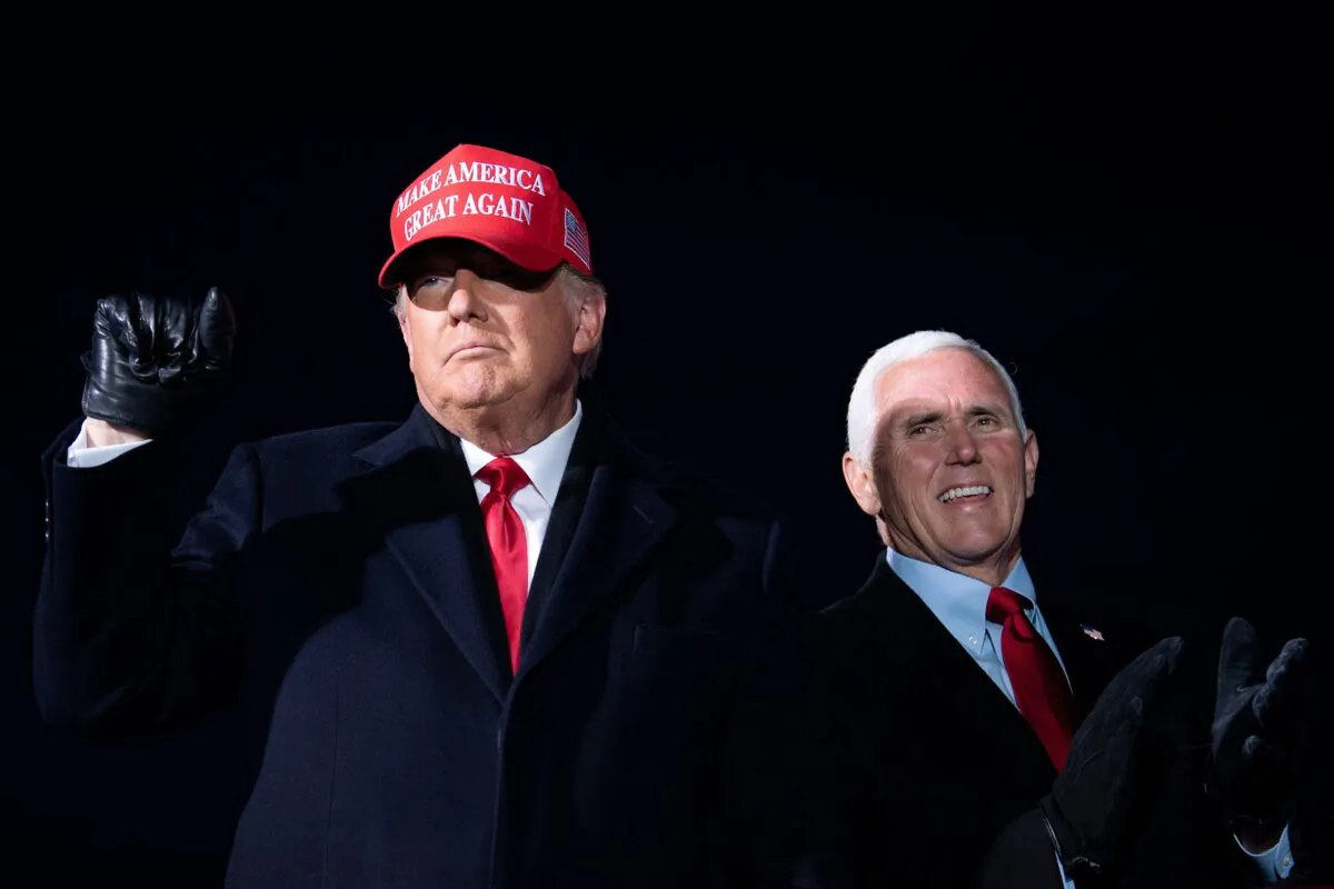 President Donald Trump arrives with Vice President Mike Pence for a rally in Traverse City, Mich., on Nov. 2, 2020. (Brendan Smialowski/AFP via Getty Images)