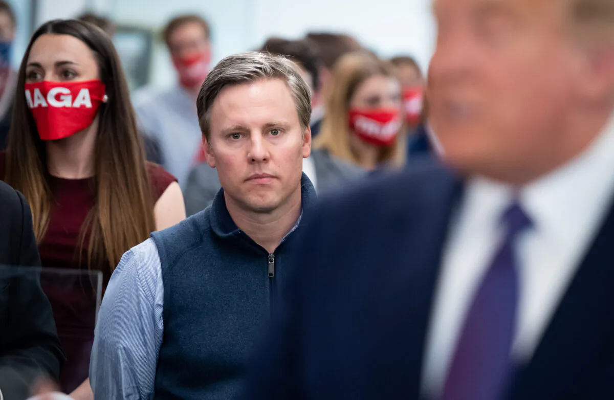 Campaign Manager Bill Stepien listens as US President Donald Trump visits his campaign headquarters in Arlington, Virginia, on Nov. 3, 2020. (SAUL LOEB/AFP via Getty Images)