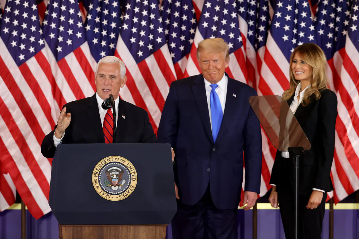 Vice President Mike Pence speaks as President Donald Trump and First Lady Melania Trump watch on election night in the East Room of the White House shortly after 2 am in Washington, DC. on Nov. 4, 2020. (Chip Somodevilla/Getty Images)