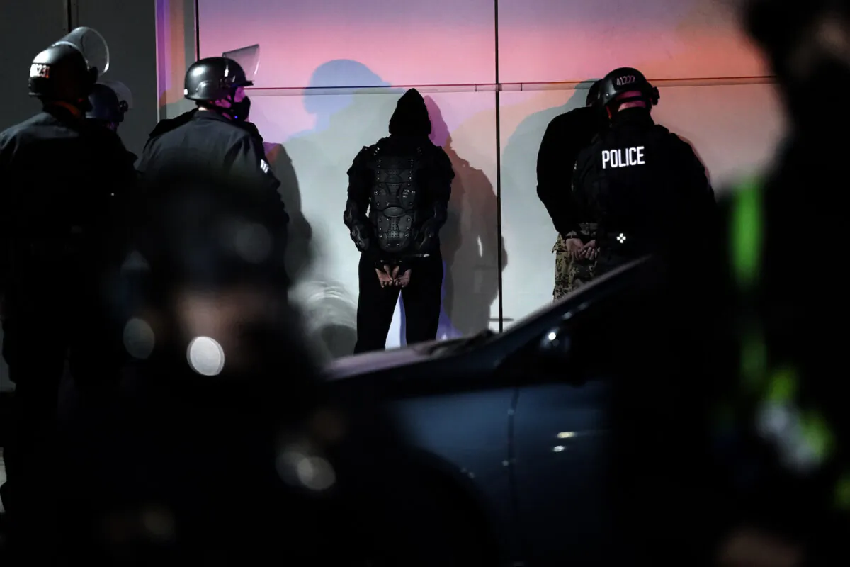 A man is detained by police on in Los Angeles, on Nov. 3, 2020. (Jae C. Hong/AP Photo)