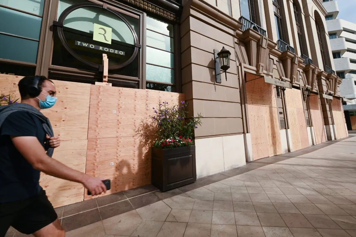 Rodeo Drive, the world renowned shopping street in Beverly Hills, California, is boarded up and closed to vehicular and pedestrian traffic on Nov. 3, 2020 as a precaution against possible violence on the day of the US presidential election. (ROBYN BECK/AFP via Getty Images)