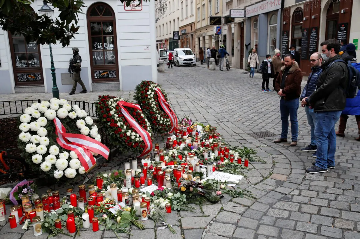 People mourn at the site of a gun attack in Vienna, Austria, Nov. 4, 2020. (Leonhard Foeger/Reuters)