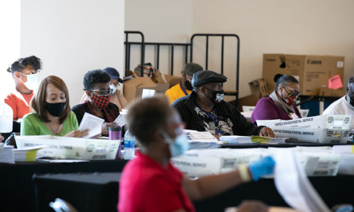 Election workers count Fulton County ballots at State Farm Arena in Atlanta, Ga., on Nov. 4, 2020. (Jessica McGowan/Getty Images)