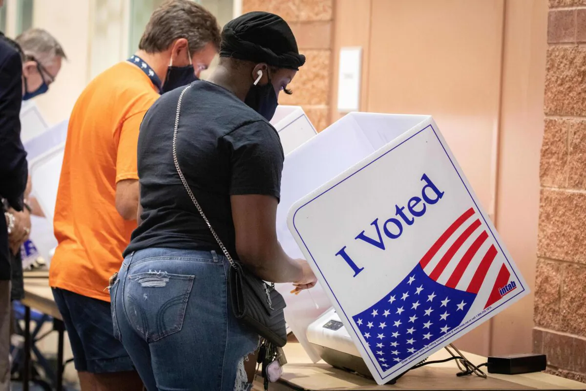 Voters cast their ballots in the voting booths at the early vote location at the Charleston Coliseum and Convention Center in North Charleston, S.C., on Oct. 16, 2020. (Logan Cyrus/AFP via Getty Images)