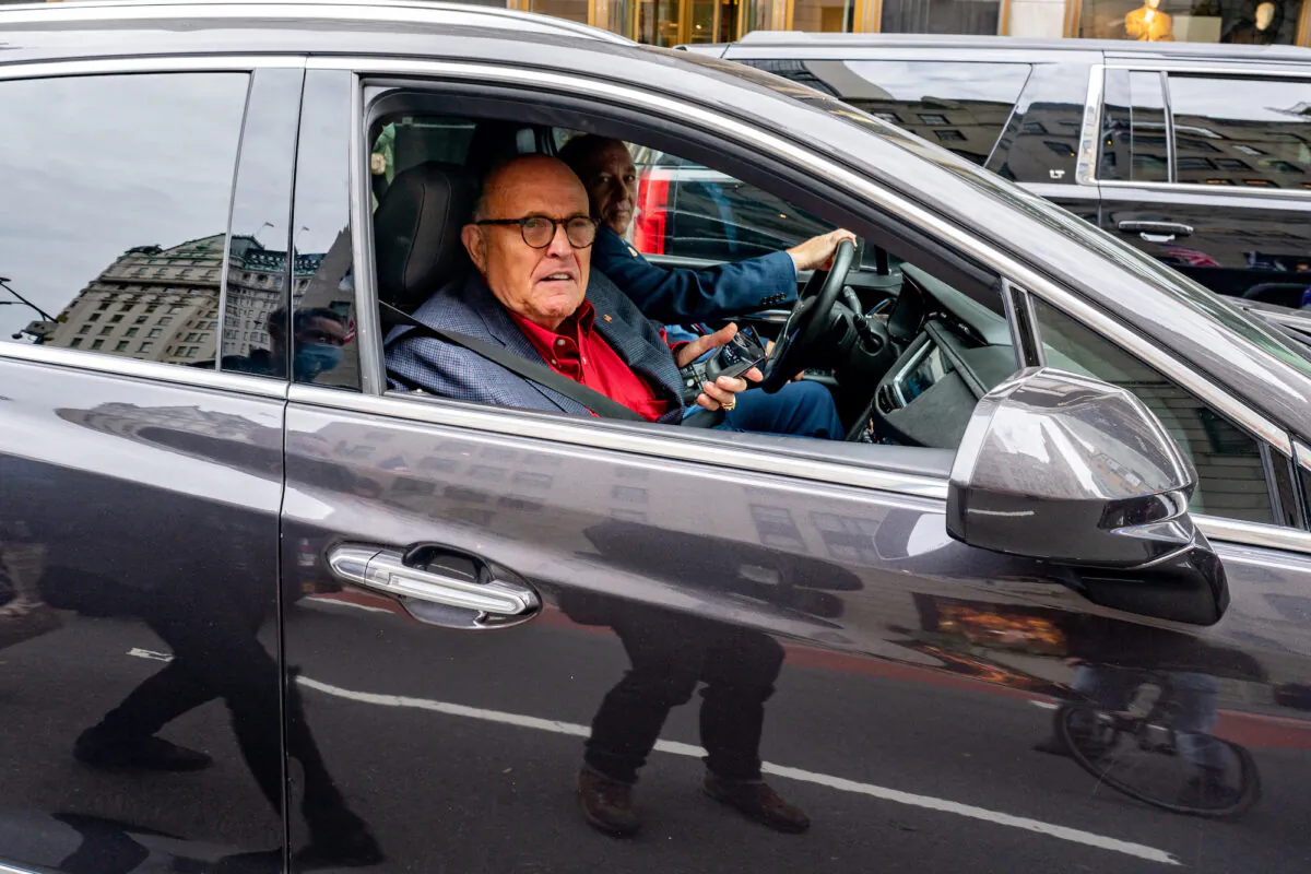 Former New York City Mayor and then-President Donald Trump's personal attorney Rudy Giuliani drives by a march and rally for President Donald Trump in New York City, N.Y., on Oct. 25, 2020. (David Dee Delgado/Getty Images)