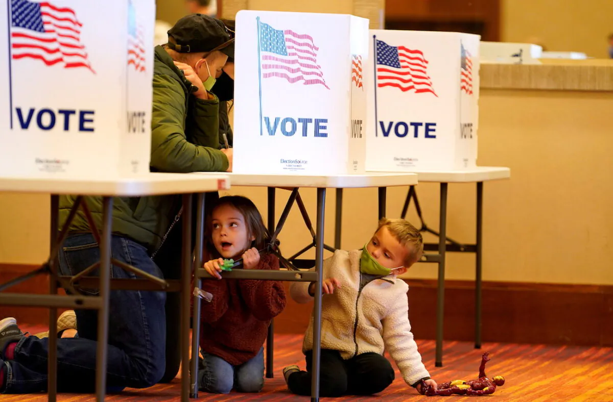 People fill out their ballots at a polling center on Election Day in Jeffersontown, Kentucky, on Nov. 3, 2020. (Bryan Woolston/TPX Images of the Day/Reuters)