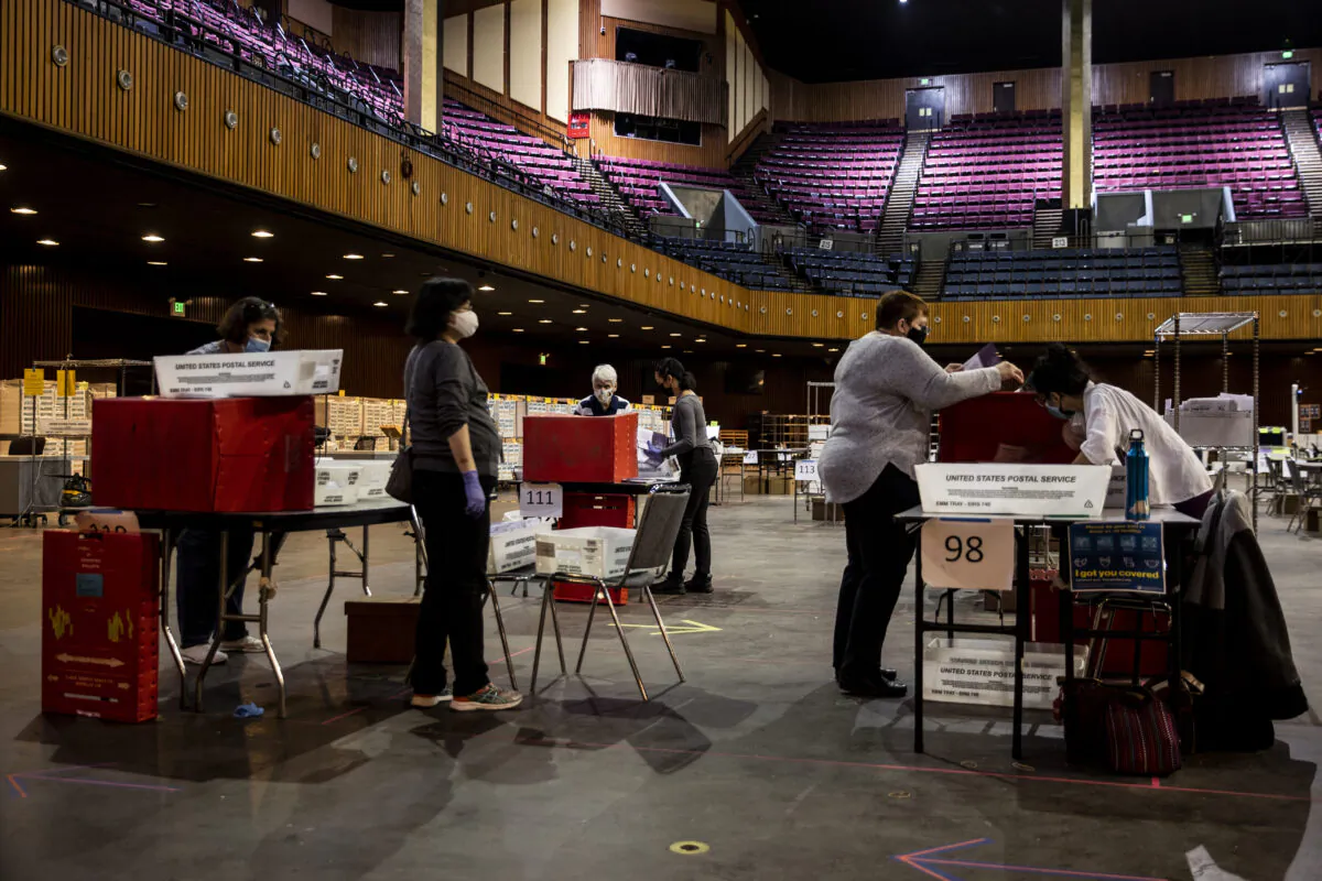 Workers sort ballots at the Bill Graham Civic Auditorium in San Francisco on Nov. 3, 2020. (Stephen Lam/Getty Images)