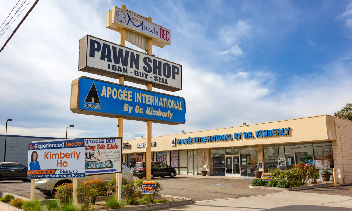 Political signs are posted in front of Apogee International, a skin care clinic that was the site of an alleged fake voting center on Election Day, in Westminster, Calif., on Nov. 5, 2020. (John Fredricks/The Epoch Times)