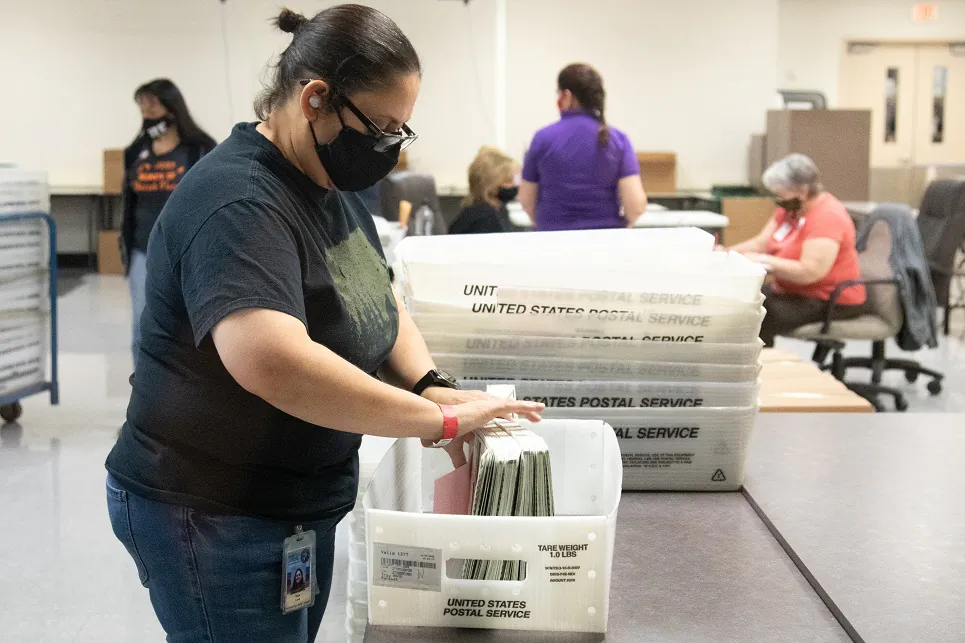 A Maricopa County Elections Department staff member counts ballots in Phoenix, Ariz., on Oct. 31, 2020. (Courtney Pedroza/Getty Images)