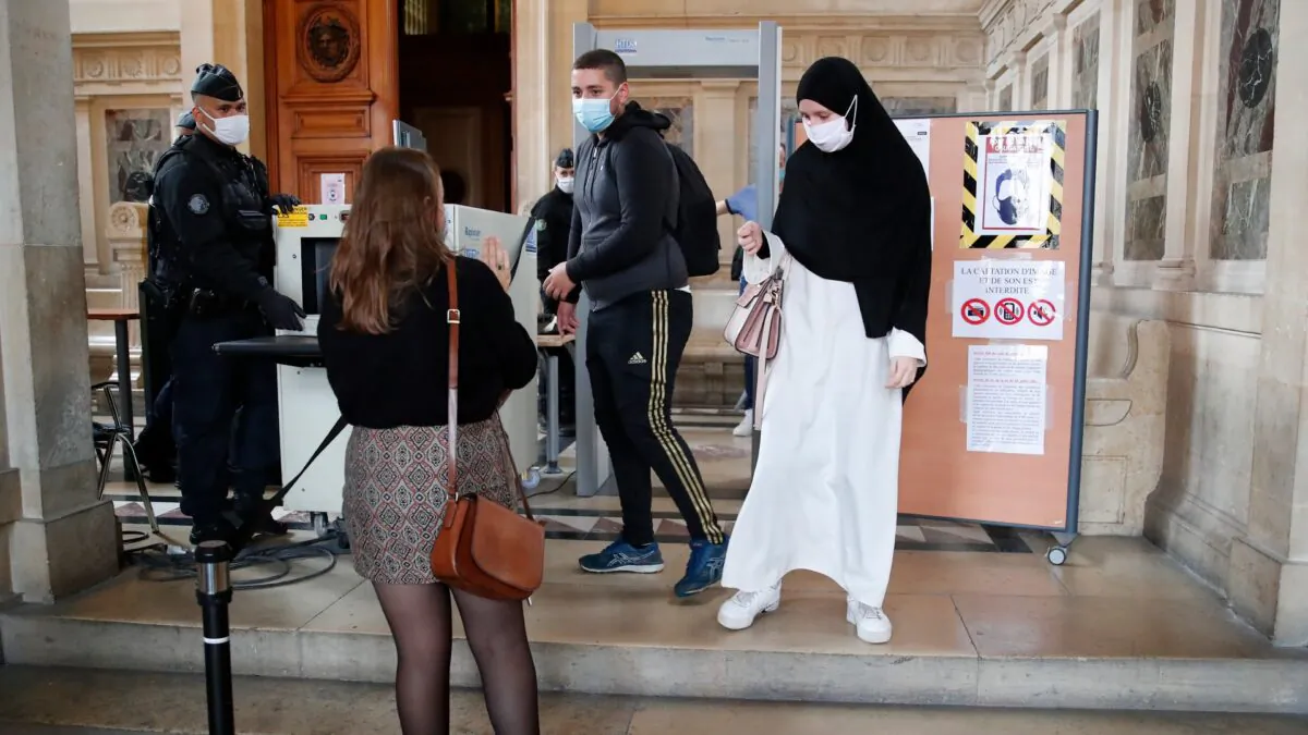 People are being checked before the trial of Sidi Ahmed Ghlam in Lyon, France, on Oct. 5, 2020. (Francois Mori/AP Photo)