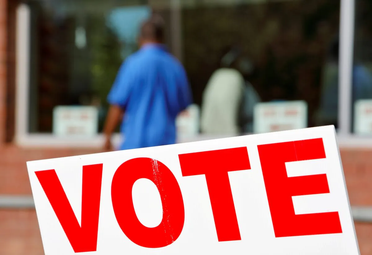 Signs direct voters into a polling station during the 2020 presidential election in Durham, Durham County, N.C., Nov. 3, 2020. (Jonathan Drake/Reuters)
