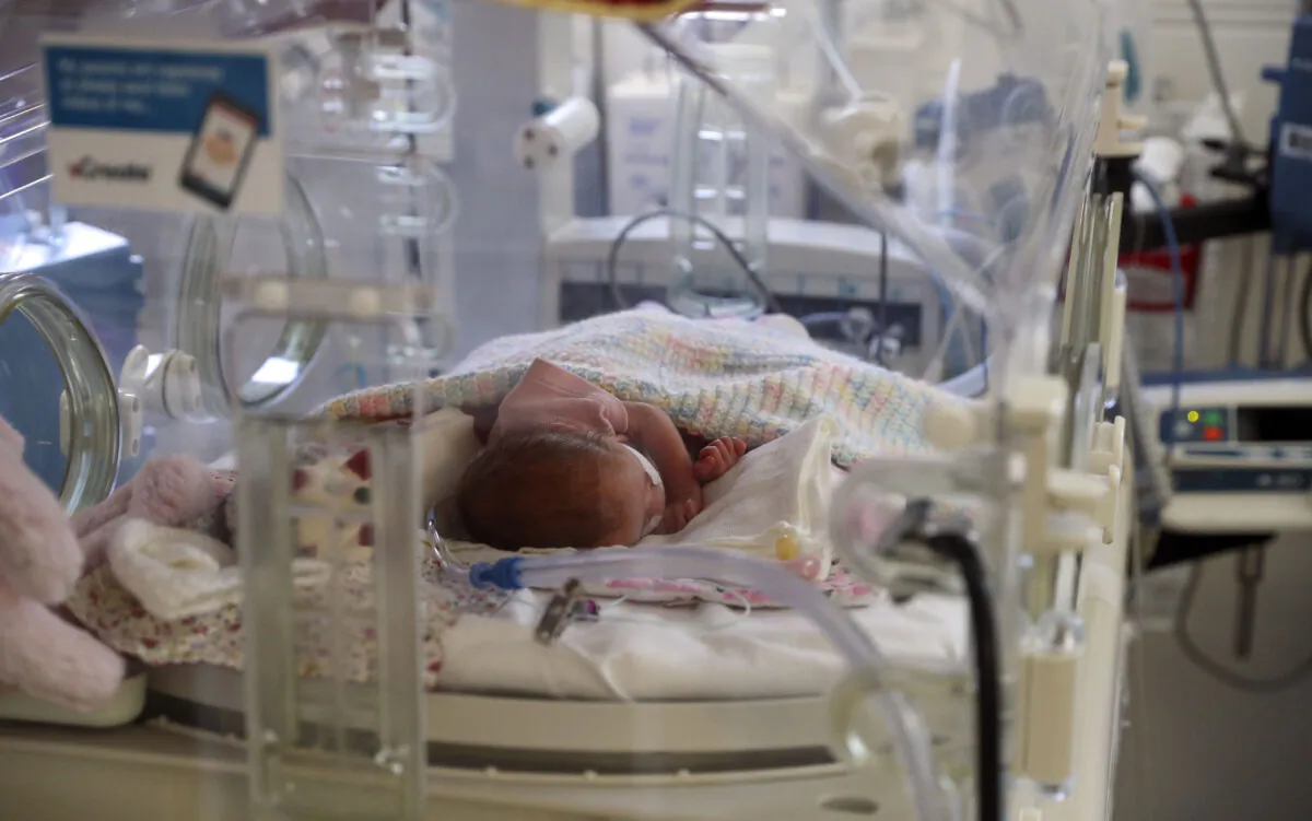 A newborn baby in the maternity ward at Frimley Park Hospital, in Frimley in Surrey, England, on May 22, 2020. (Steve Parsons - Pool/Getty Images)