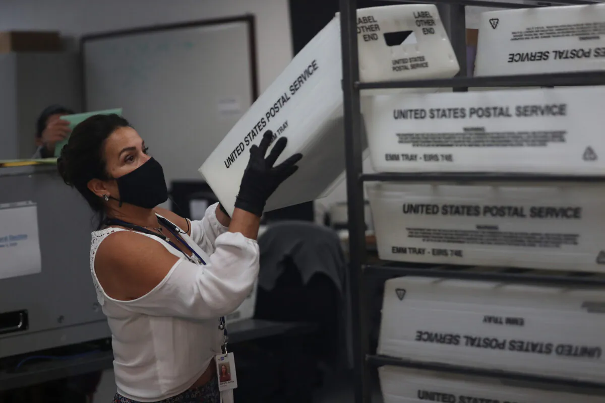 A worker at the Miami-Dade County Elections Department works on tabulating the Vote by Mail ballots that have been returned in Doral, Fla. on Nov. 3, 2020. (Joe Raedle/Getty Images)