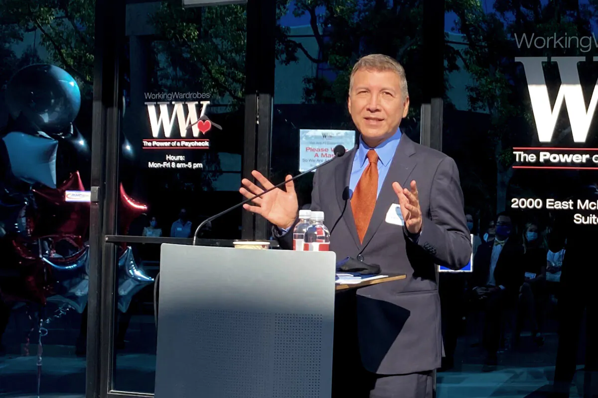 Santa Ana City Councilmember Vicente Sarmiento speaks at the ribbon-cutting of a new location for the nonprofit Working Wardrobes career center in Santa Ana, Calif., on Sept. 30, 2020. (Jack Bradley/The Epoch Times)