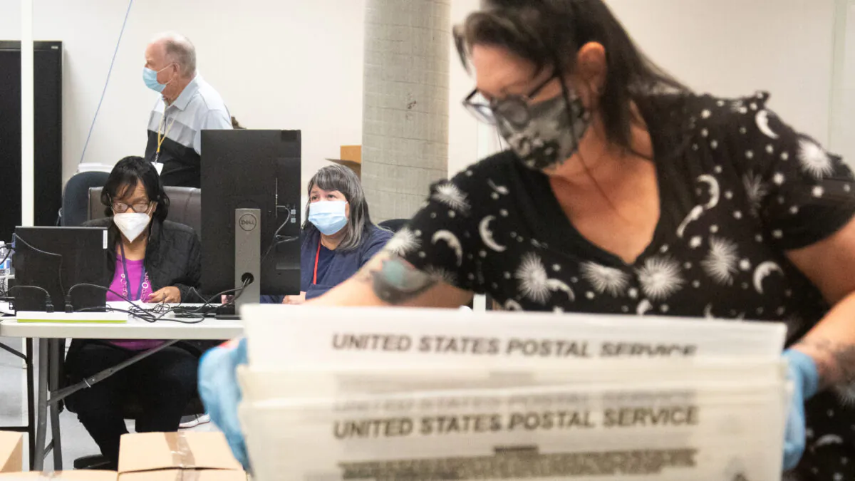 Ballots are counted by Maricopa County Elections Department staff ahead of Tuesday's election in Phoenix, Ariz., on Oct. 31, 2020. (Courtney Pedroza/Getty Images)