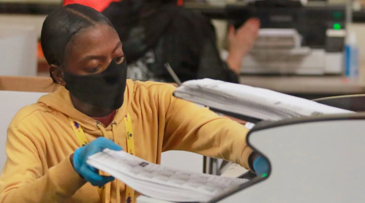 A worker handles official ballots at the Clark County Election Department in North Las Vegas, Nev., on Nov. 5, 2020,. (Ronda Churchill/AFP via Getty Images)