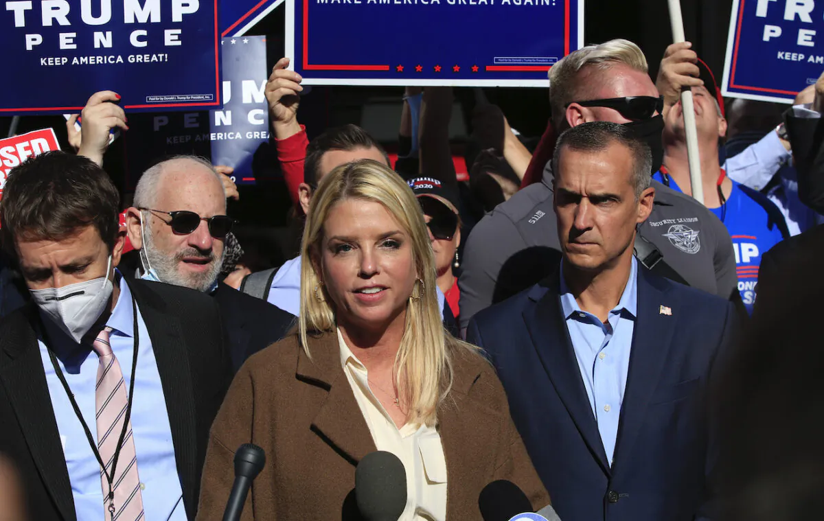 Former Florida Attorney General Pam Bondi, with Trump campaign adviser Corey Lewandowski (C R), speaks outside the Pennsylvania Convention Center in Philadelphia, Pennsylvania on Nov. 5, 2020. (Kena Betancur/AFP via Getty Images)
