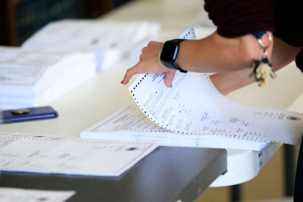 Electoral workers began processing ballots