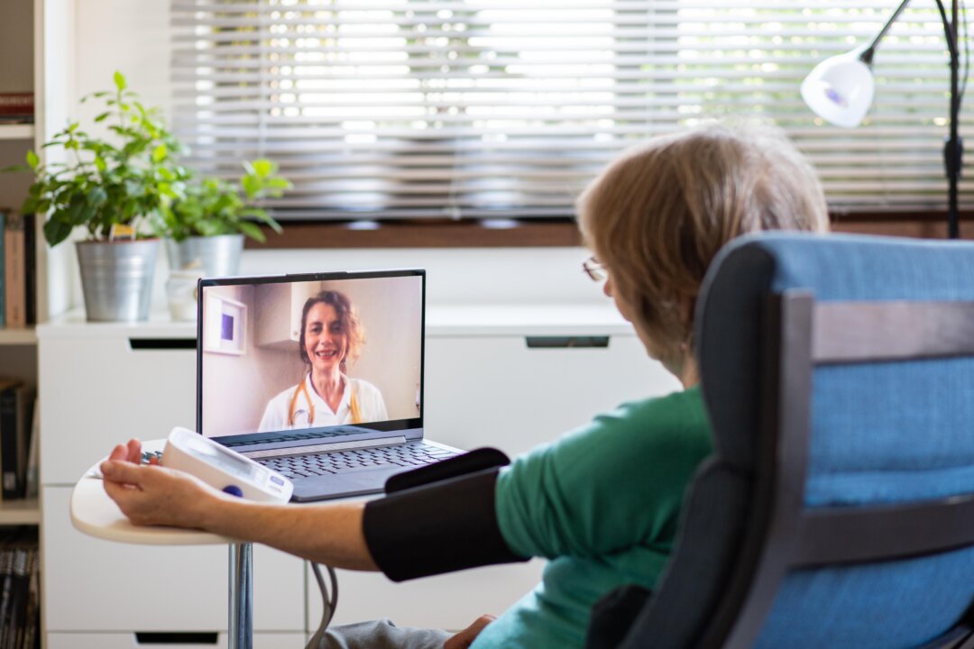 COVID-19 has forced many physicians and patients to adopt virtual appointments through telephone or video conferencing. The move has revealed the convenience of this approach. (Melinda Nagy/Shutterstock)