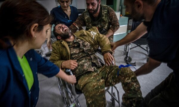 A soldier is taken into a hospital
