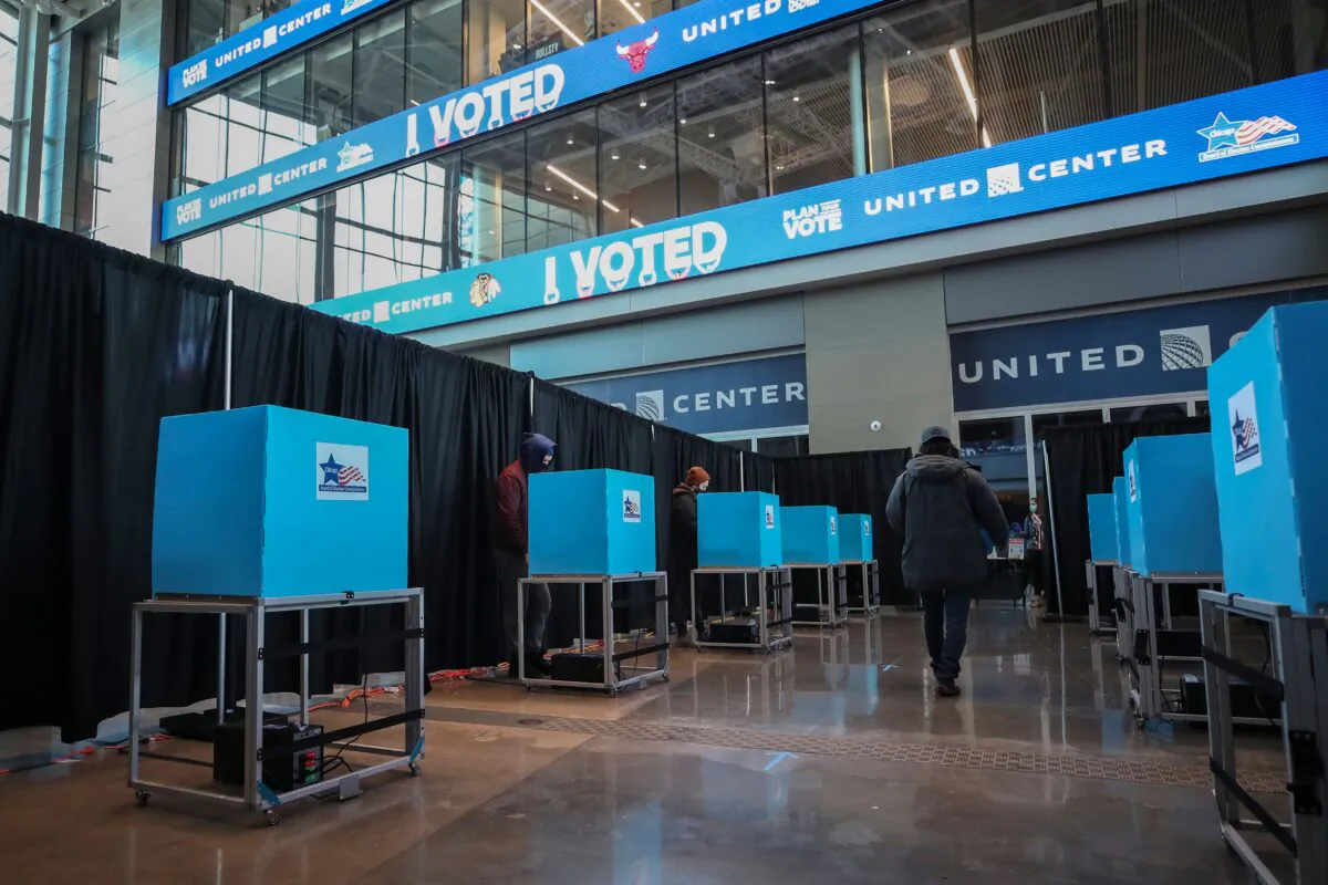 People cast their ballots at the United Center on Election Day in Chicago, Ill., on Nov. 3, 2020. (Kamil Krzaczynski/AFP via Getty Images)