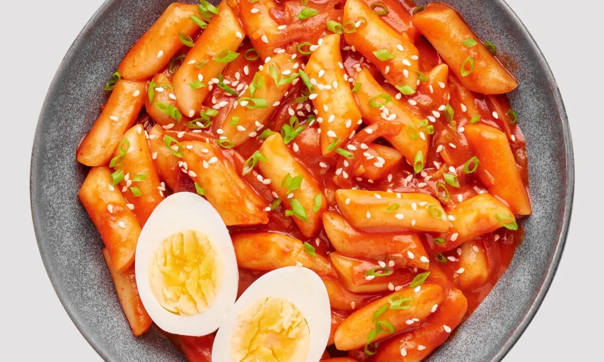 In its most basic form, tteokbokki consists of rice cakes swimming solo in a glistening, gochujang-spiced sauce. (Kravtzov/Shutterstock)