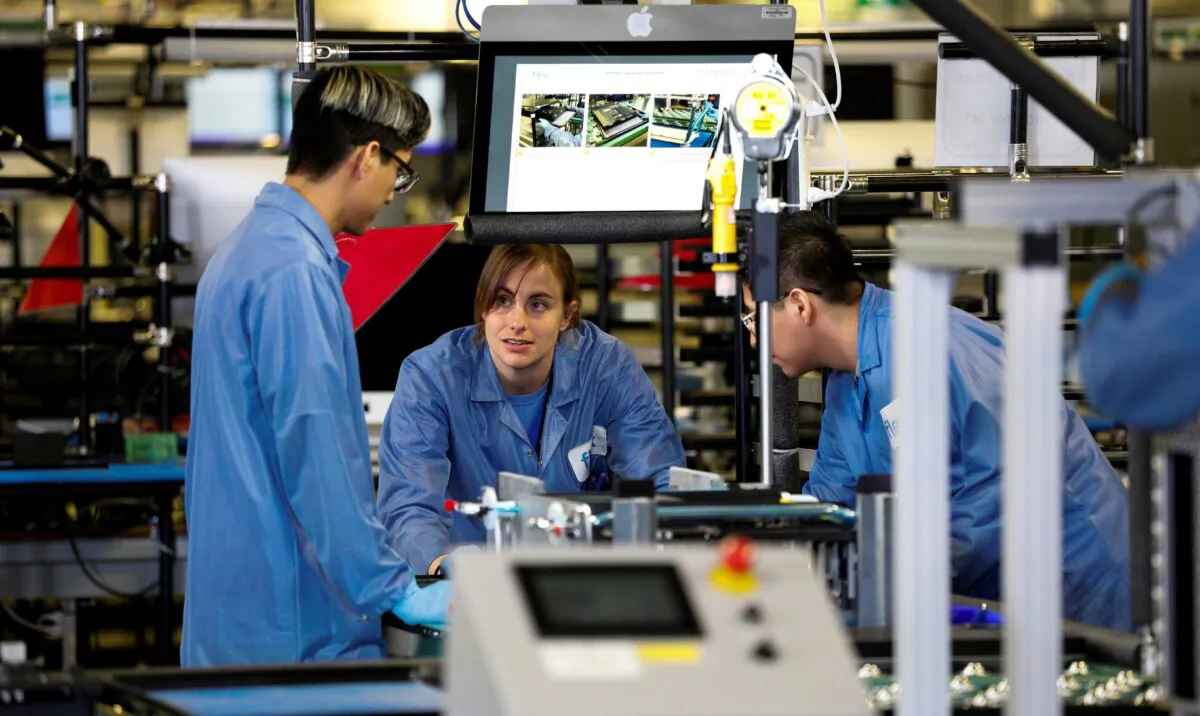 Flextronics International Apple factory employees work on Apple Mac Pro computer assembly in Austin, Texas, on Nov. 20, 2019. (Tom Brenner/Reuters)