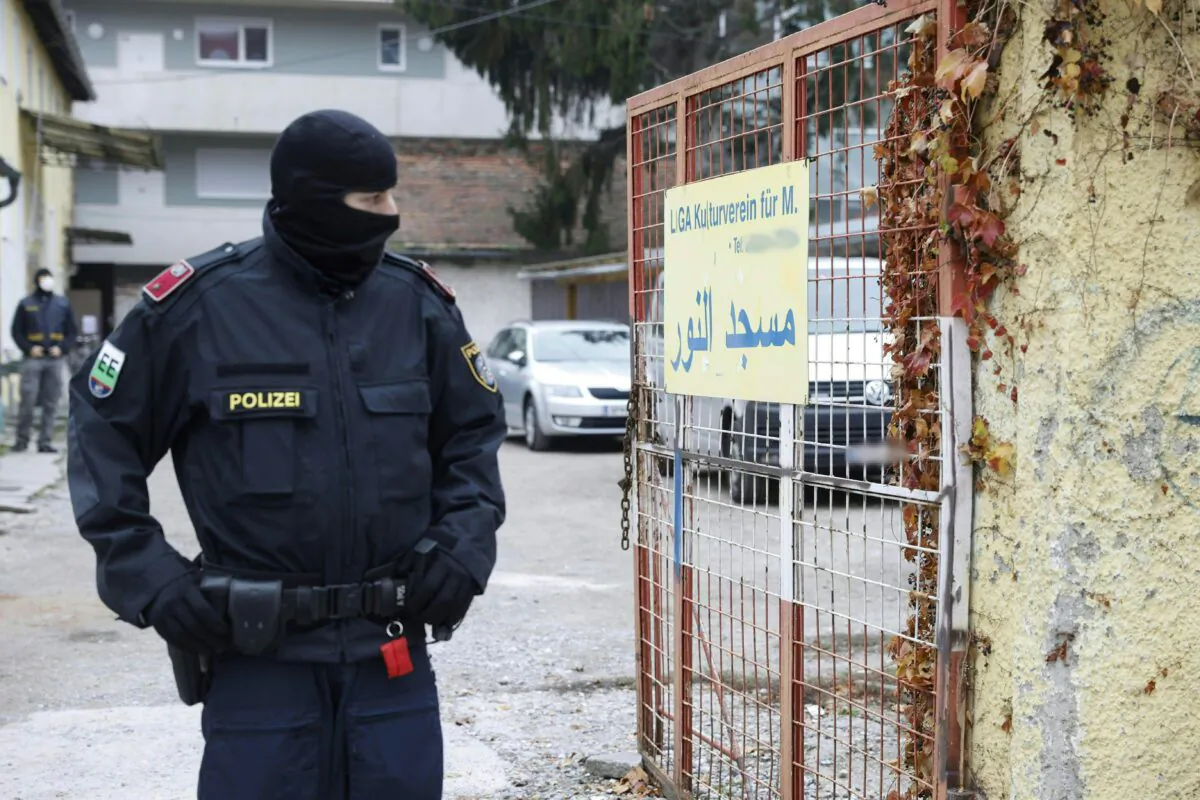 A police officer stands guard outside a property following an anti-terror raid, in Graz, Austria, on Nov. 9, 2020. (Erwin Scheriau/APA/AFP via Getty Images)