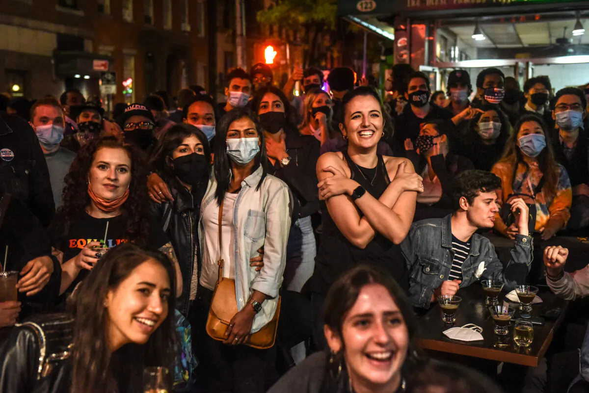 Supporters of Democratic candidate Joe Biden watch a broadcast in the West Village in New York on Nov. 7, 2020. (Stephanie Keith/Getty Images)