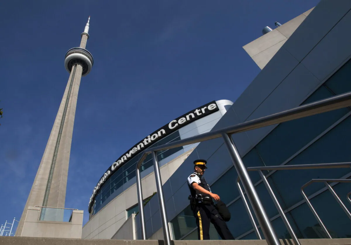 An RCMP officer patrols outside the Metro Toronto Convention Centre on June 25, 2010. (The Canadian Press/Frank Gunn)