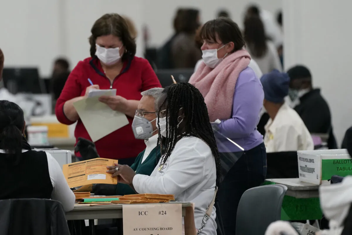 Absentee ballots are processed at the central counting board,  in Detroit, Mich., on Nov. 4, 2020. (Carlos Osorio/AP Photo)
