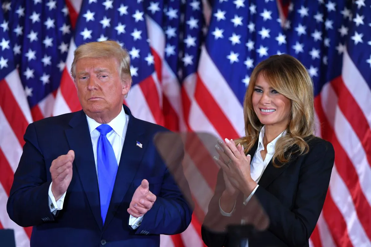 President Donald Trump claps alongside First Lady Melania Trump after speaking in the East Room of the White House in Washington, early on Nov. 4, 2020. (Mandel Ngan/AFP via Getty Images)