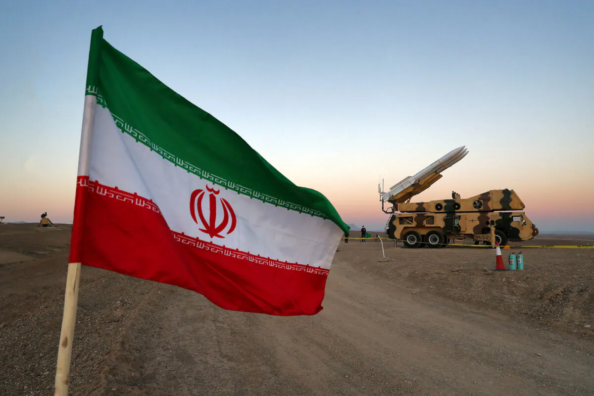 An Iranian flag near in a missile during a military drill in Iran on Oct. 19, 2020. (West Asia News Agency via Reuters)