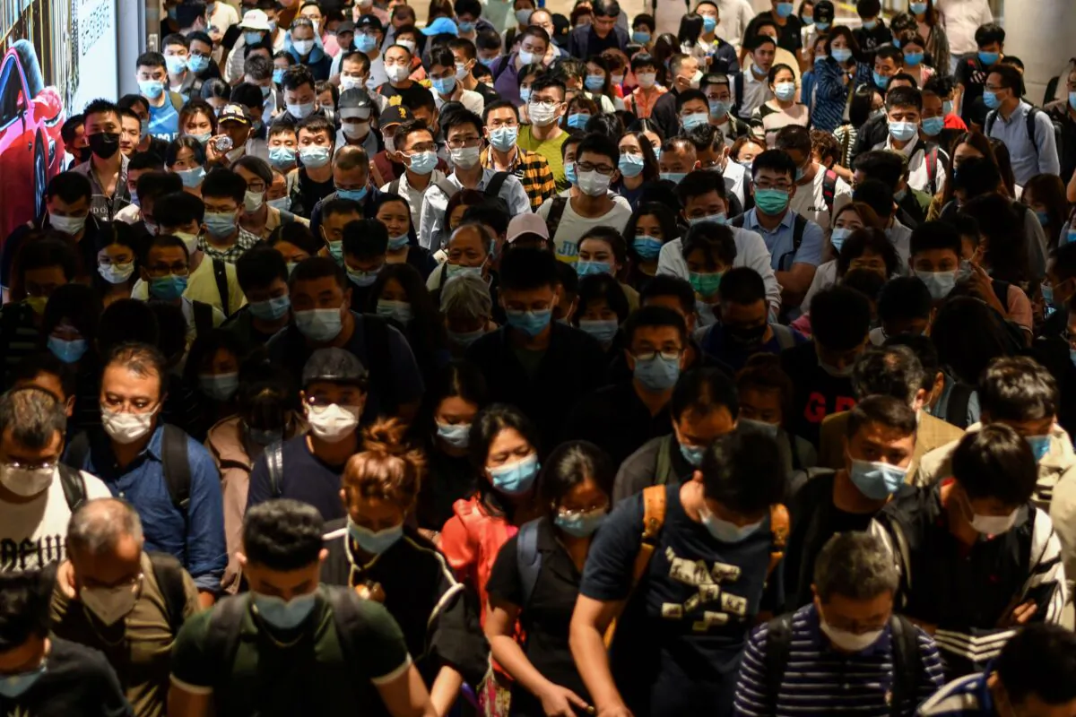 Passengers arrive at Pudong International Airport in Shanghai, China on Sept. 29, 2020. (HECTOR RETAMAL/AFP via Getty Images)