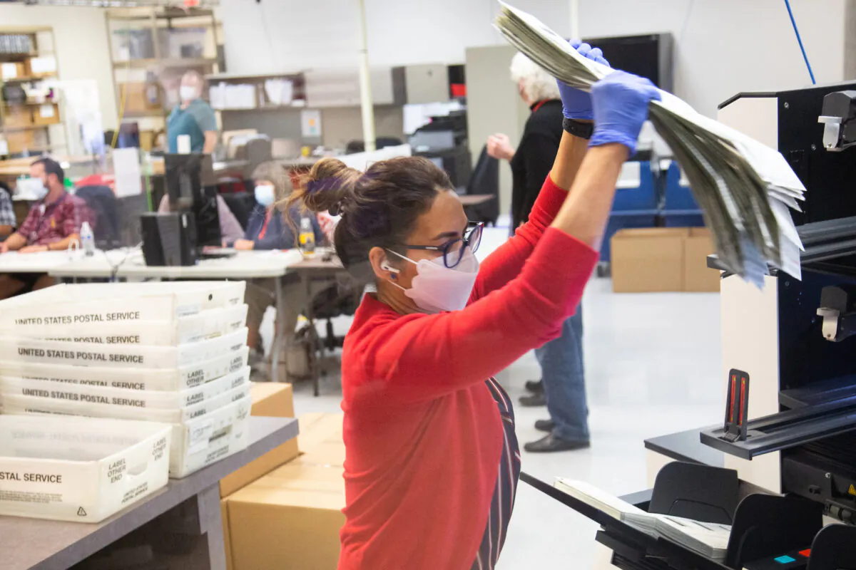 Votes are counted by staff at the Maricopa County Elections Department office in Phoenix, Ariz., on Nov. 5, 2020. (Courtney Pedroza/Getty Images)