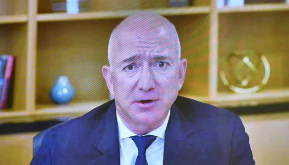 Amazon CEO Jeff Bezos is seen on a screen as he testifies before the House Judiciary Subcommittee on Antitrust, Commercial, and Administrative Law on "Online Platforms and Market Power" in the Rayburn House Office Building on Capitol Hill in Washington, on July 29, 2020. (Mandel Ngan/File Photo/Pool via Reuters)