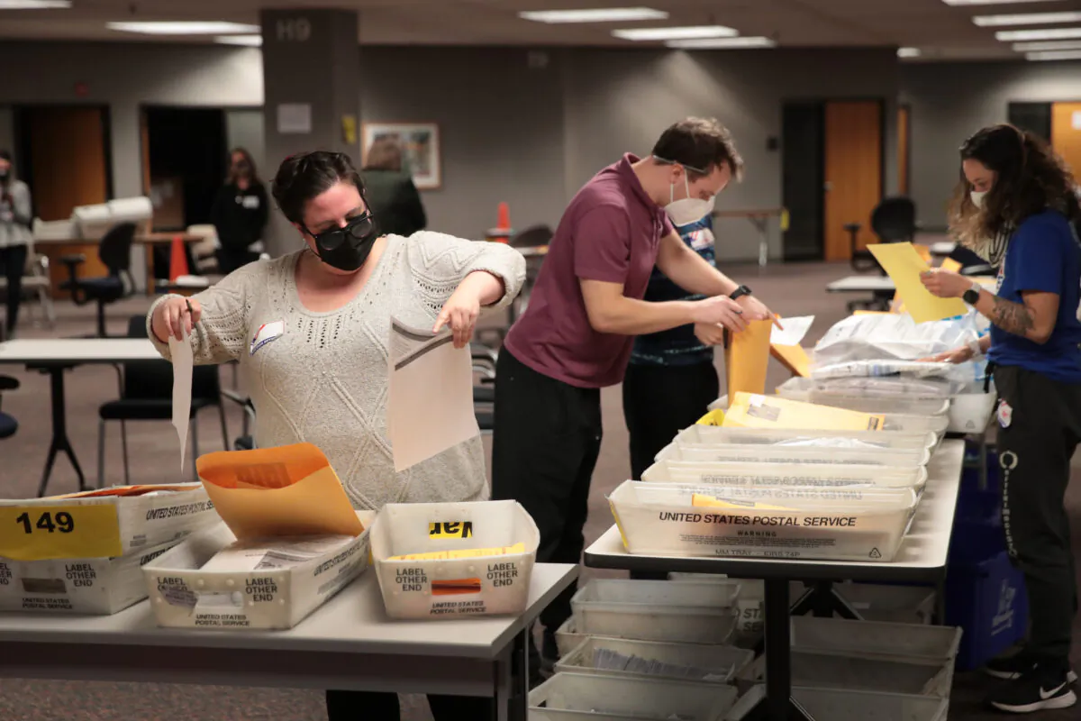 Election officials count absentee ballots on Nov. 4, 2020, in Milwaukee. (Scott Olson/Getty Images)