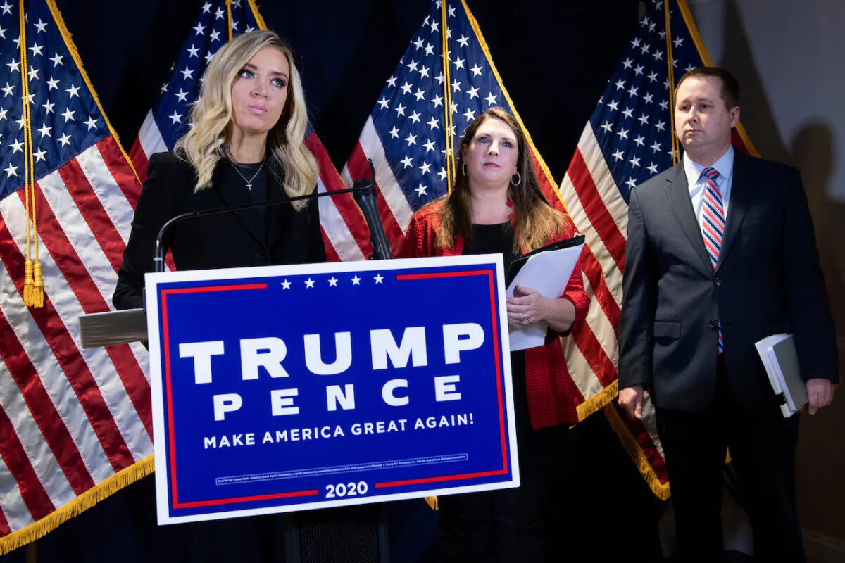 Chairman of the Republican National Committee Ronna McDaniel (C) and Trump Campaign general council Matthew Morgan (R) listen while White House Press Secretary Kayleigh McEnany (C) speaks during a press conference at the headquarters of the Republican National Committee in Washington, on Nov. 9, 2020. (Brendan Smialowski/AFP via Getty Images)